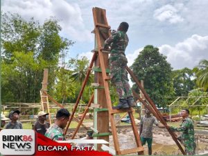 Satgas Yonif 762/VYS Gotong-Royong dengan Warga Bangun Masjid Al-Wahid